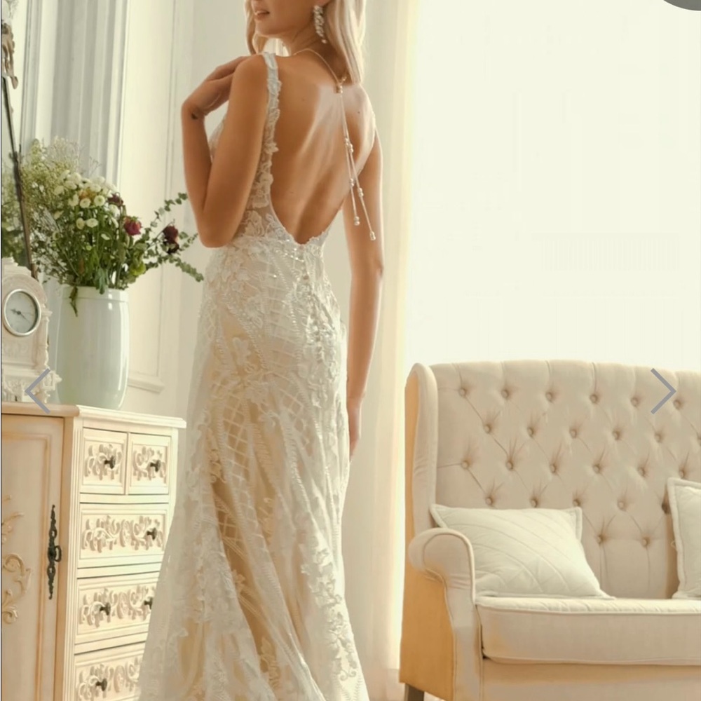 Bridal wedding dress never worn. Found something else I wanted. Color is white